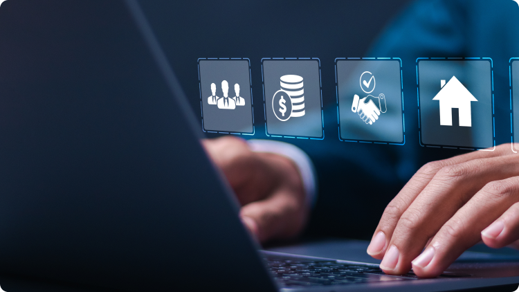 A person using a laptop with various icons displayed on the screen.