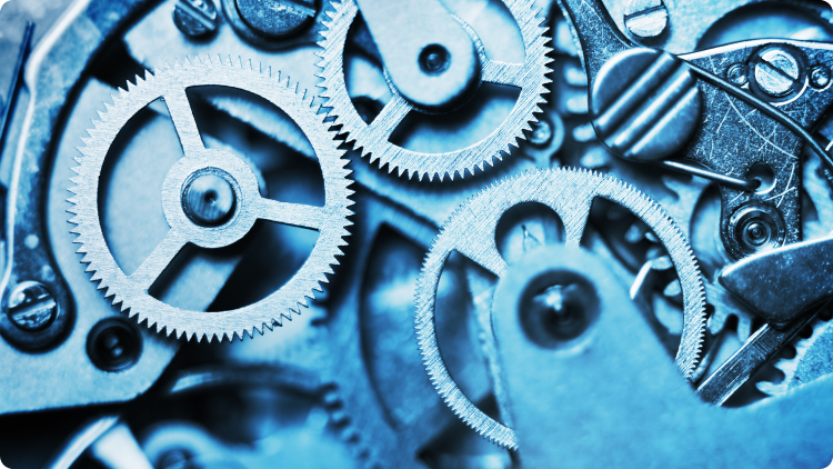 Close-up view of a clockwork mechanism, featuring finely crafted gears and components, illustrating precision engineering.