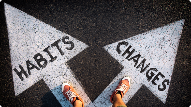 Image of a person on the road with 'habits' and 'changes' written, representing improving habits and making wise financial decisions.