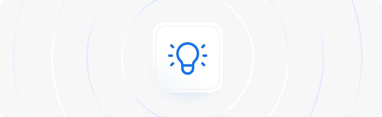 A blue light button centred on a plain white background, representing tips and ideas