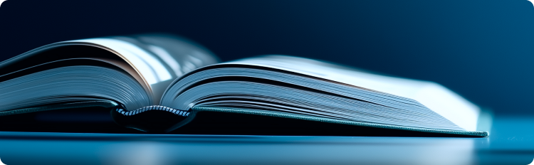 An open book resting on a blue background, showcasing its pages and inviting readers to explore its content