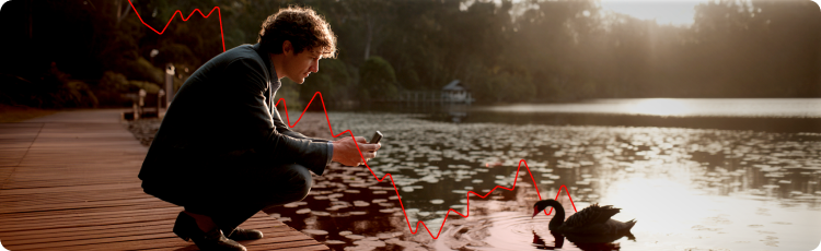 Investor duduk di tepi danau menganalisis data pasar di ponselnya, dengan black swan di air dan overlay grafik saham merah melambangkan peristiwa keuangan tak terduga dan risiko black swan