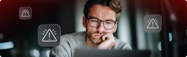 Homem olhando para um laptop com vÃ¡rios Ã­cones de aviso simbolizando riscos de negociaÃ§Ã£o, volatilidade do mercado e alertas de investimento.