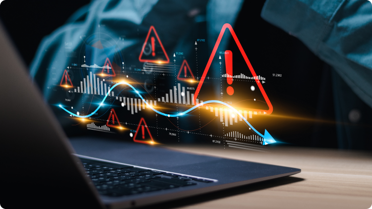 Seorang pria menganalisis data di laptop dengan grafik ditampilkan di depan layar