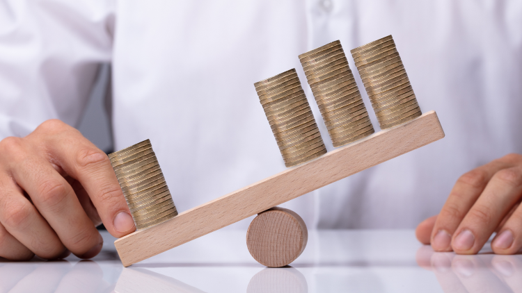 Pile of coins on balance beam