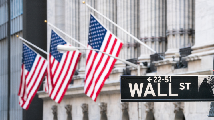 Wall street sign and the USA flags