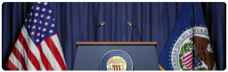  Un podium sur lequel figurent le drapeau amÃ©ricain et un sceau officiel, symbole dâautoritÃ© et dâÃ©vÃ©nements officiels.