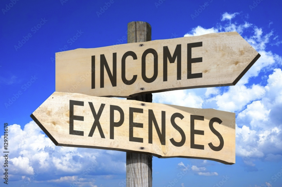 Income, expenses - a wooden signpost