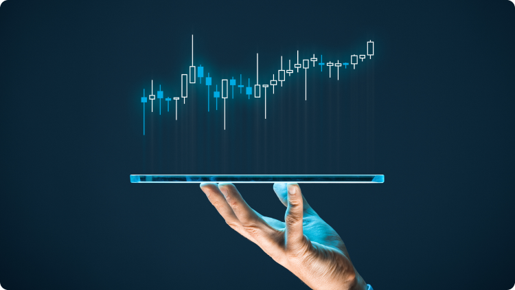 MÃ£o a segurar um tablet com um grÃ¡fico de investimento