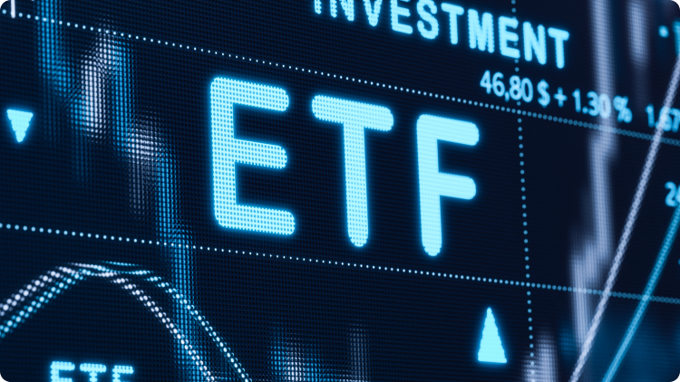 ETF inscription on a computer screenâs close-up, with rising chart in the background.