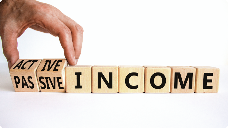  a hand moving wooden blocks with inscriptions âactiveâ, âpassiveâ and âincomeâ - representing 2 choices in investing