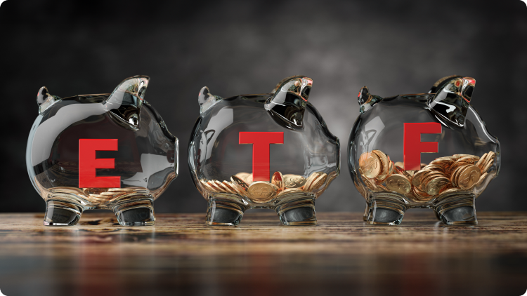 Money in piggy bank with ETF inscription in red.