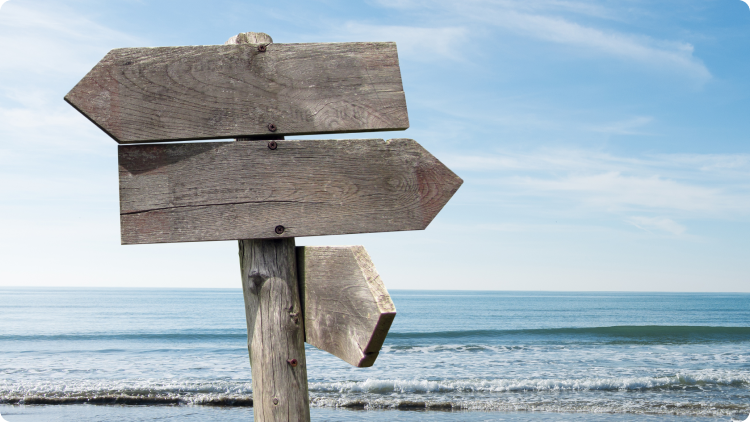 signpost against the background of mountains