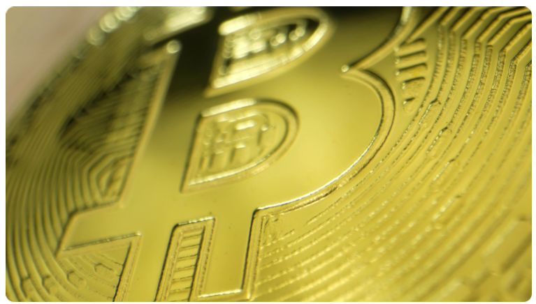 Logo de la crypto-monnaie Bitcoin sous la forme d'une piÃ¨ce d'or