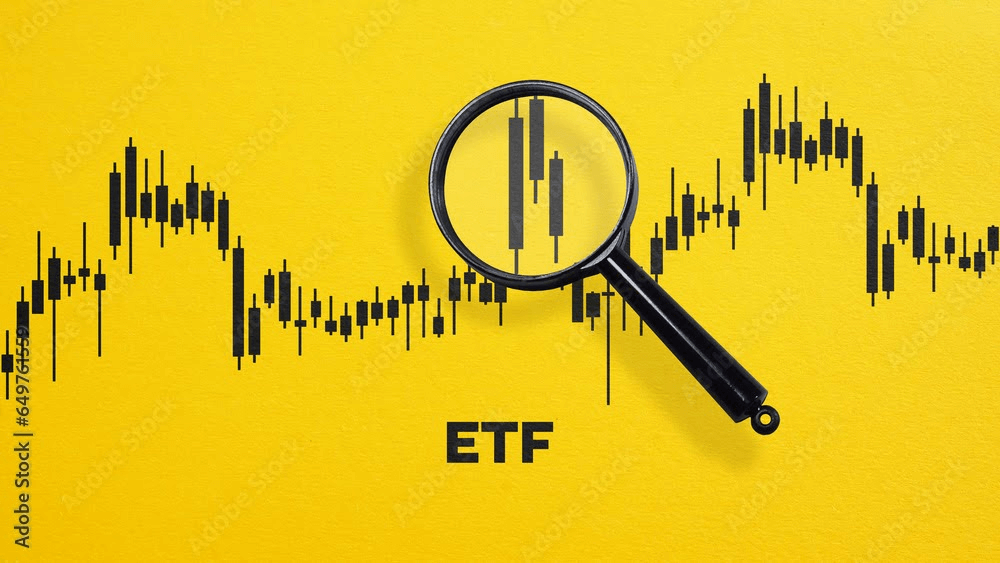 Exchange Traded Fund ETF acronym and the chart through magnifying glass on orange background